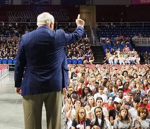 President Bonner holding up J sign.